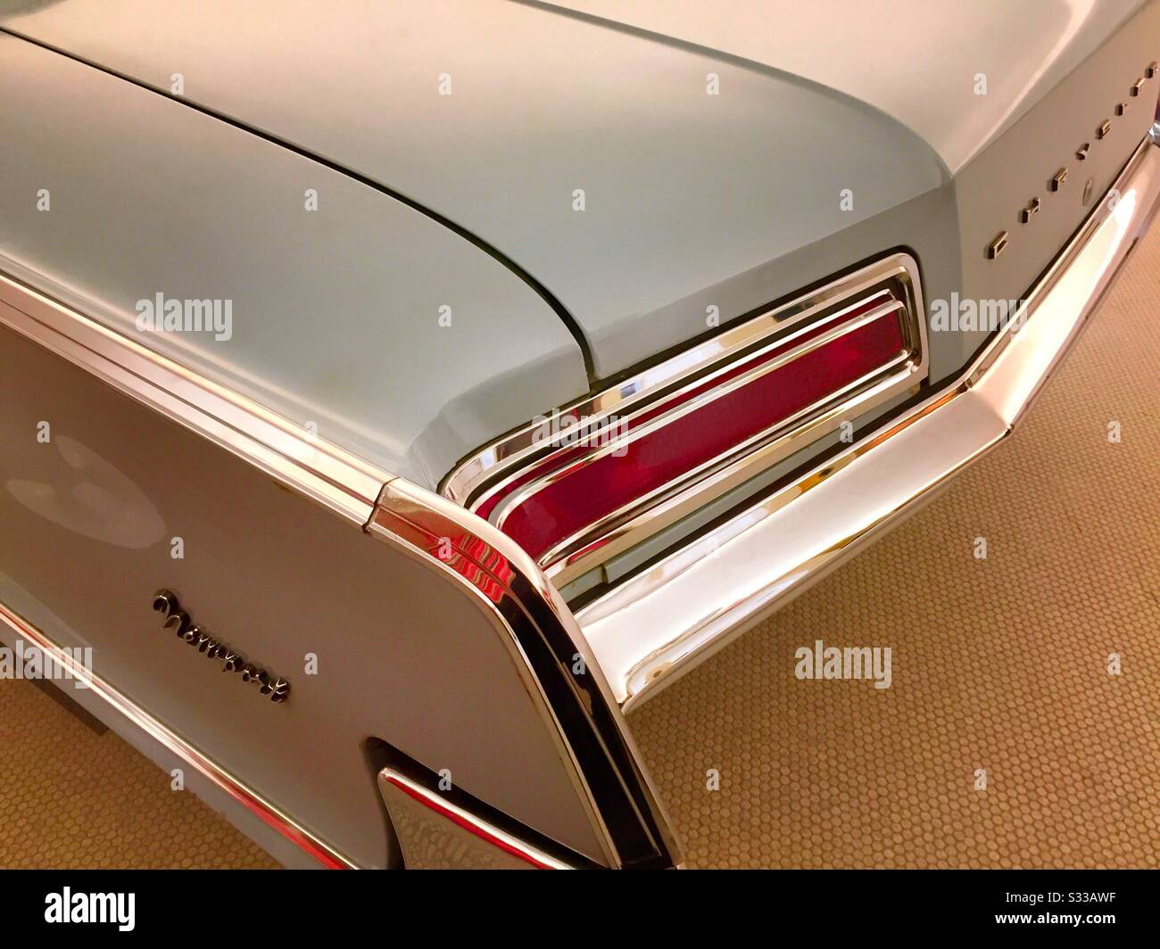 Vintage 1962 Chrysler Newport automobile chrome rear bumper, fender and trunk close up, USA Stock Photo