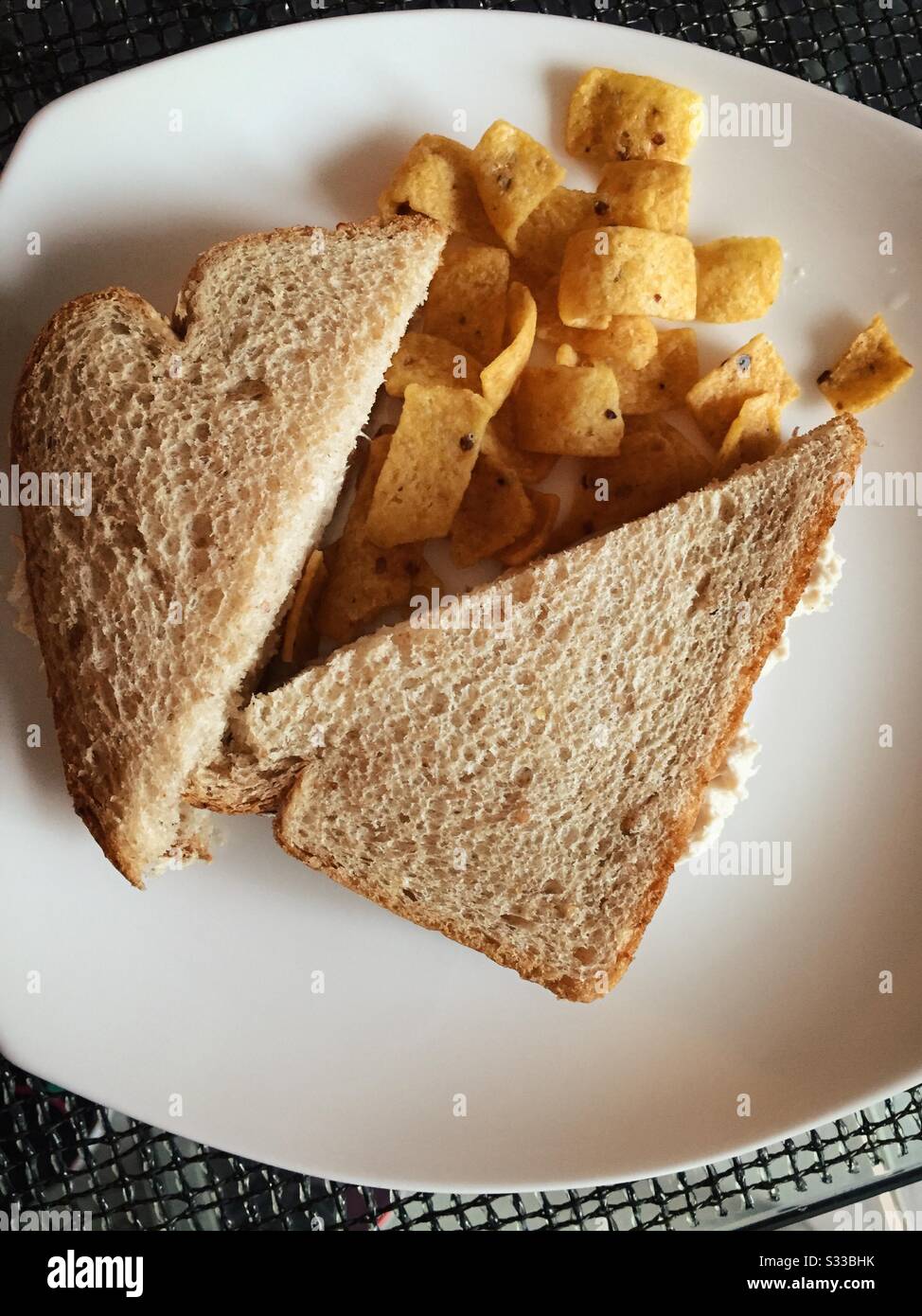 Flat lay of tuna sandwich on whole wheat bread and corn chips lunch Stock Photo Alamy