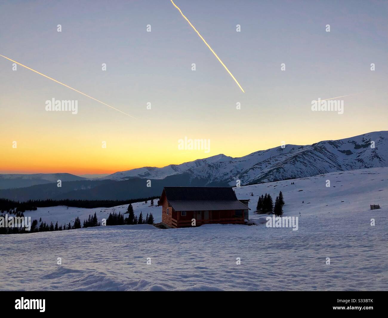 Cabin in the mountains at dusk - Smartphone Captured Stock Image