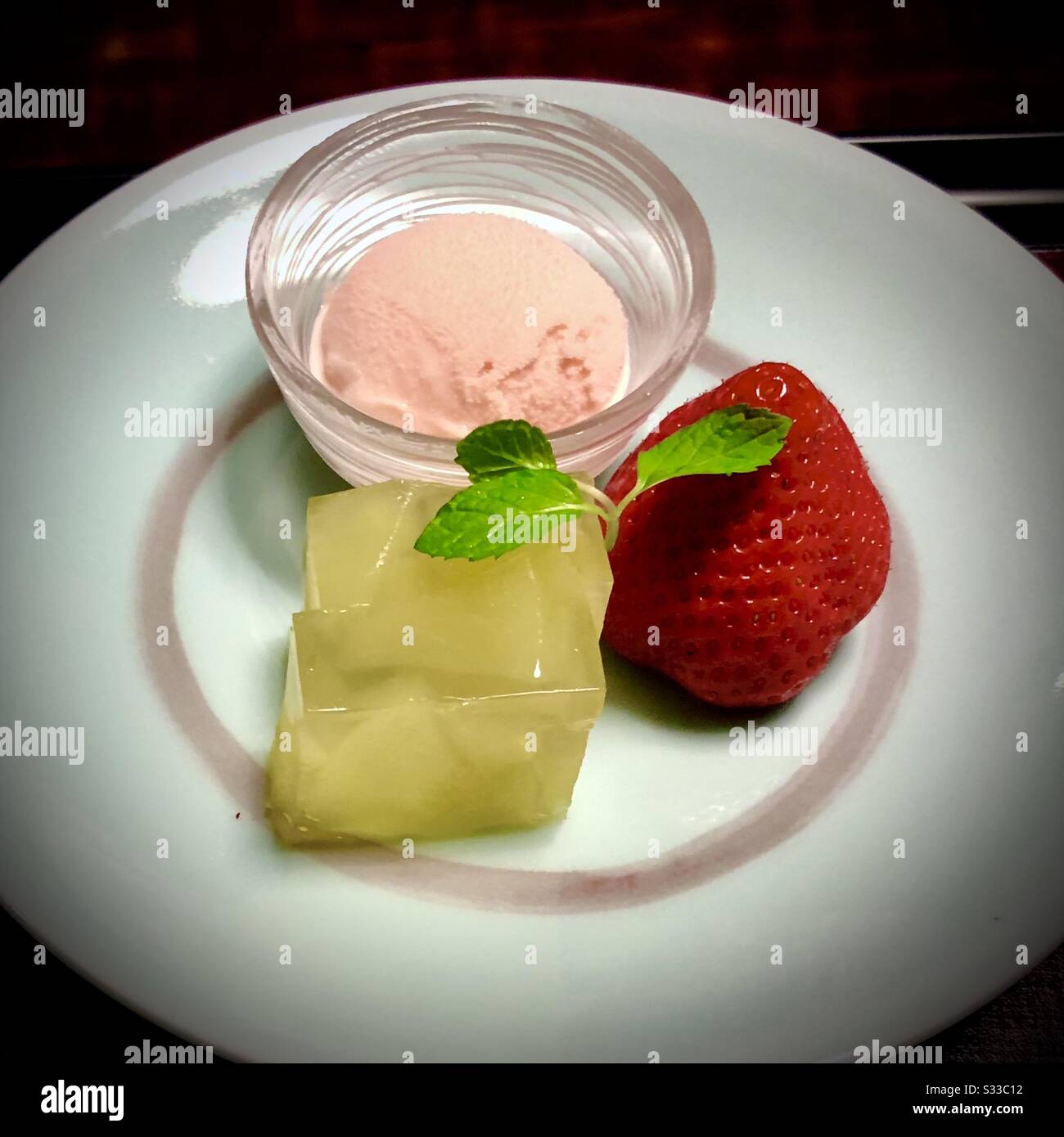 Dessert: strawberry, jello, and ice cream with mint leaves - Smartphone Captured Stock Image