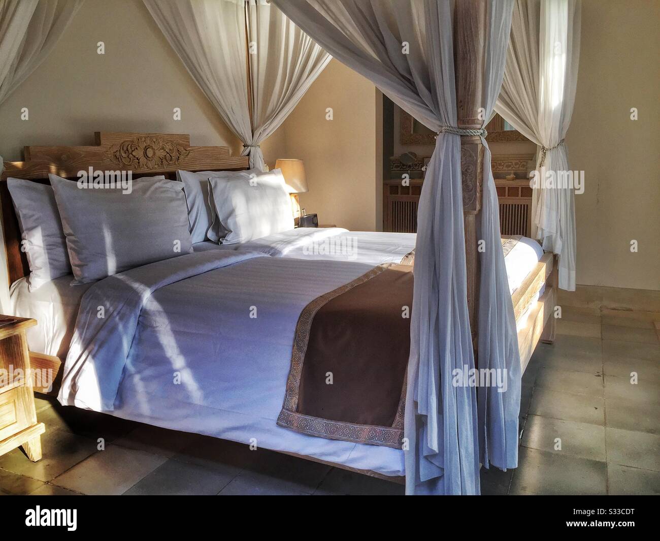 The second bedroom of a suite at Desa Visesa, a luxury resort near Ubud, Bali, Indonesia - Smartphone Captured Stock Image