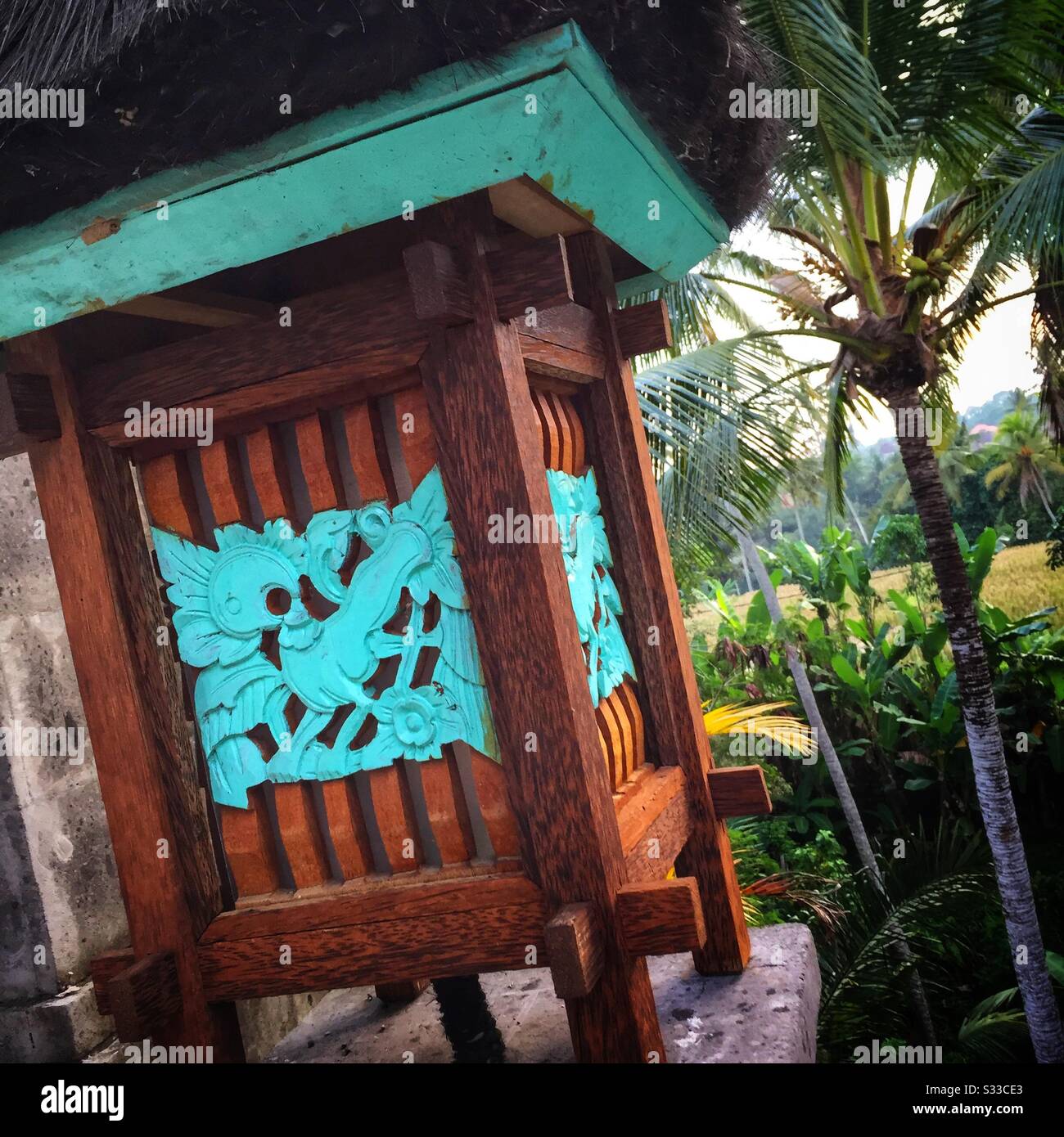A small shrine on the terrace of a suite at Desa Visesa, a luxury resort near Ubud, Bali, Indonesia - Smartphone Captured Stock Image