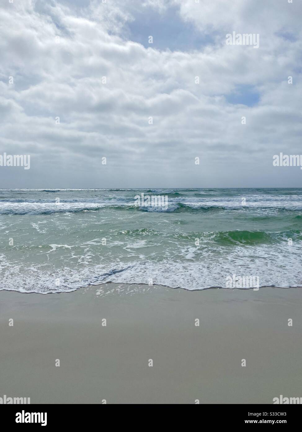 View of the Emerald colored water of Gulf of Mexico on Destin, Florida beach Stock Photo