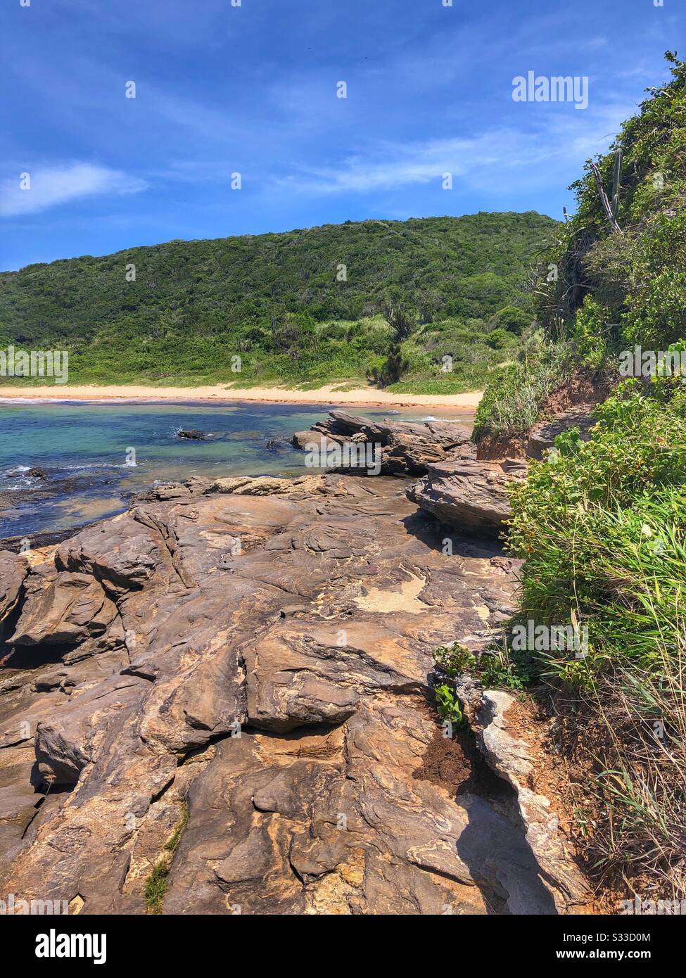 The rocky shoreline in Buzios, Brazil. Stock Photo