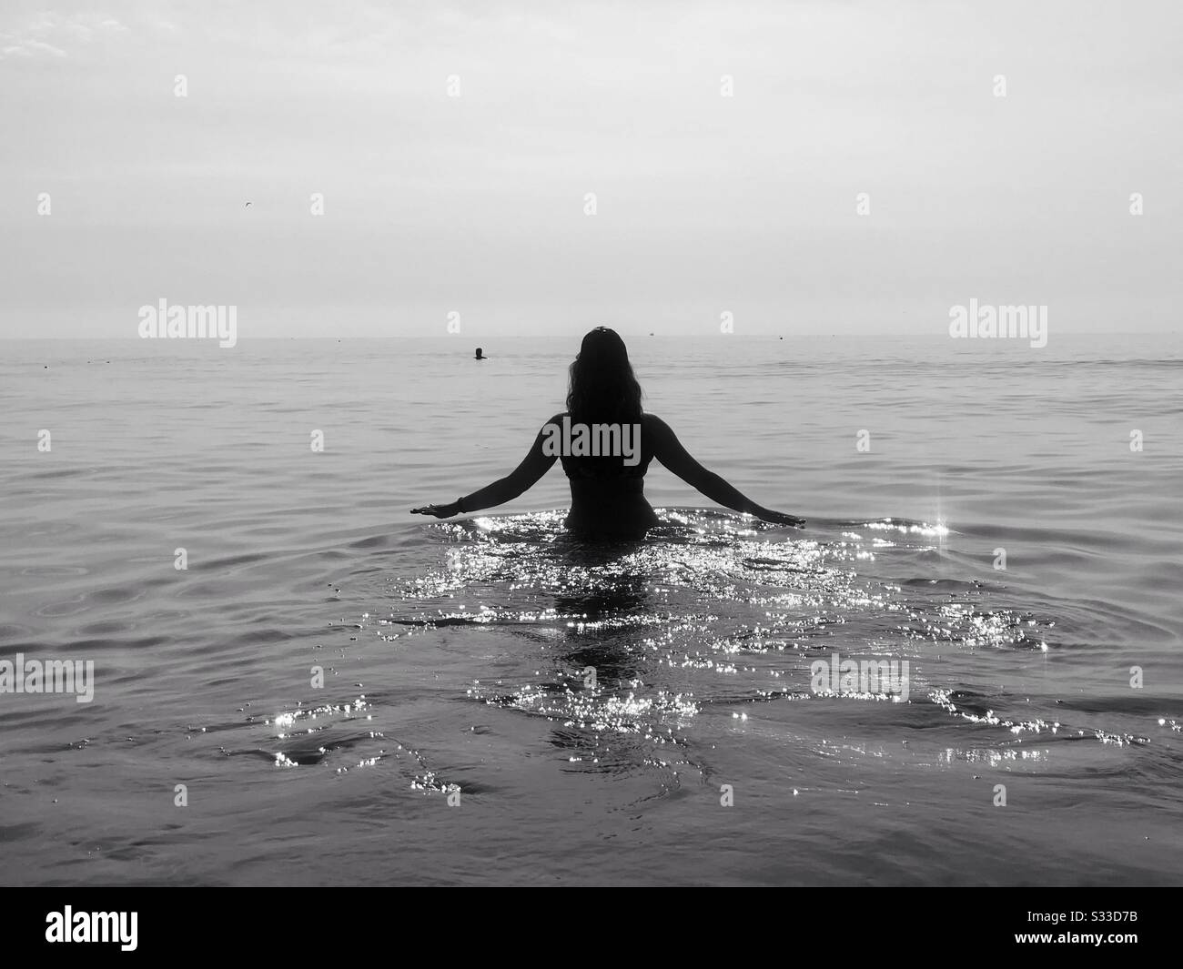 Black and white photo of woman in the water Stock Photo - Alamy