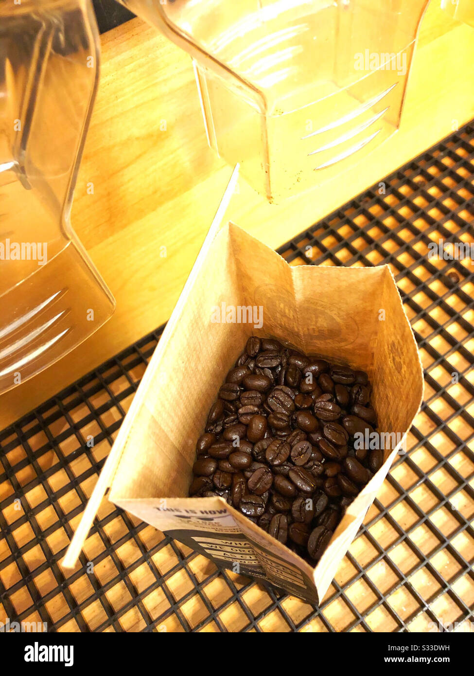 Buying organic coffee beans in bulk at local food coop store Stock