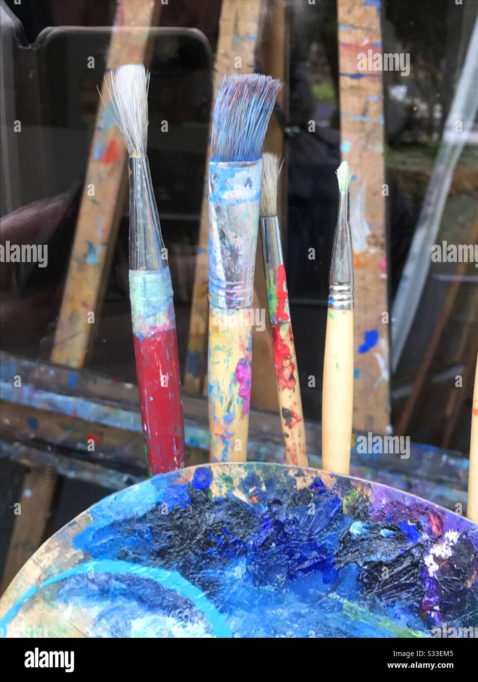 Paint brushes and palette. - Smartphone Captured Stock Image