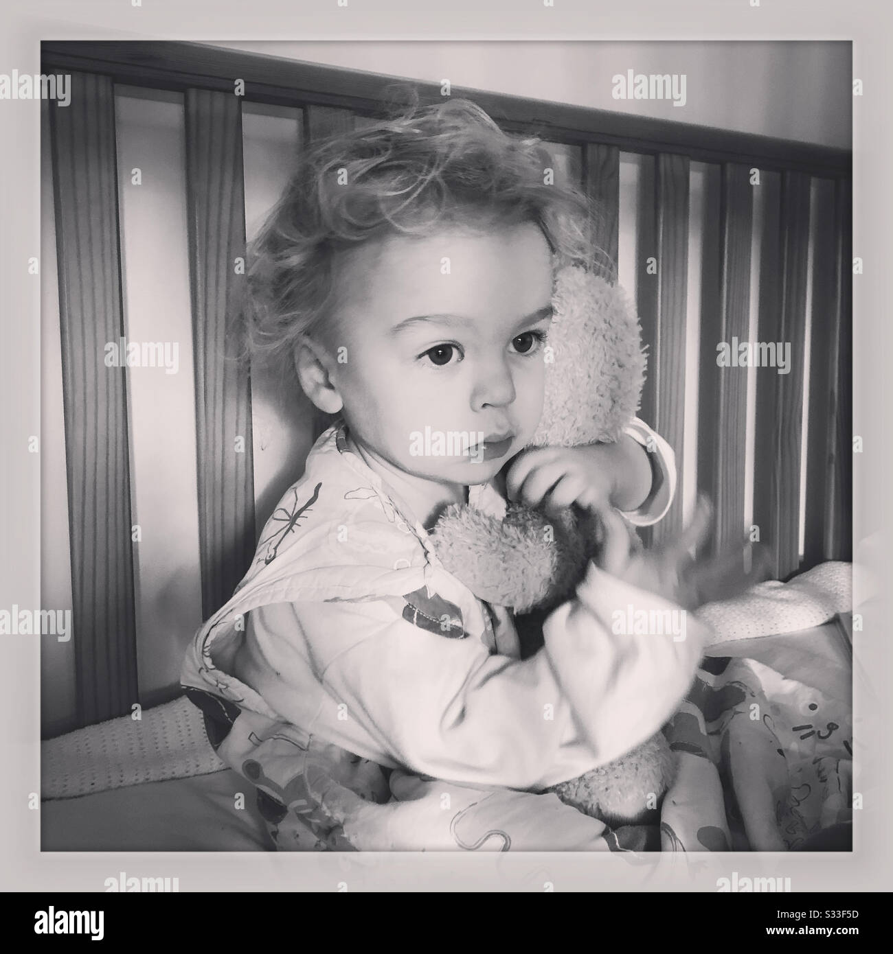 Baby in cot - Smartphone Captured Stock Image