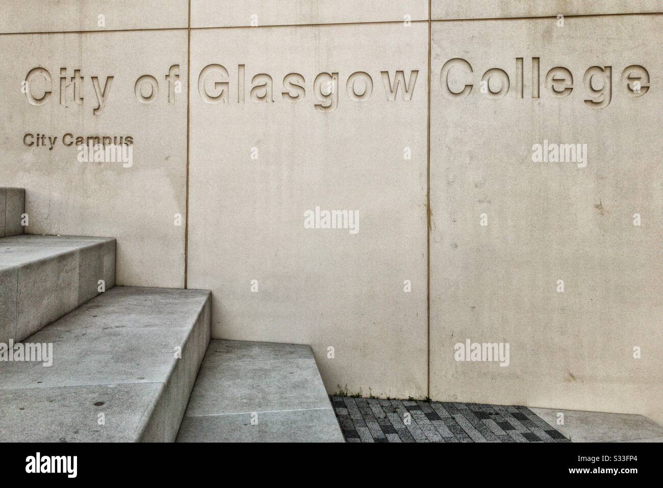 Indent on wall of City of Glasgow College in Glasgow, Scotland. Stock Photo
