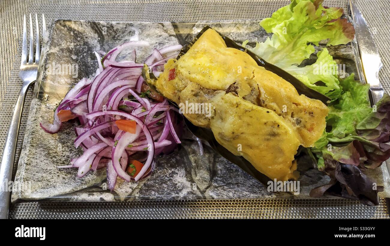 Latinamerican cuisine. Tamale. Filled with vegetables and meat. Stock Photo