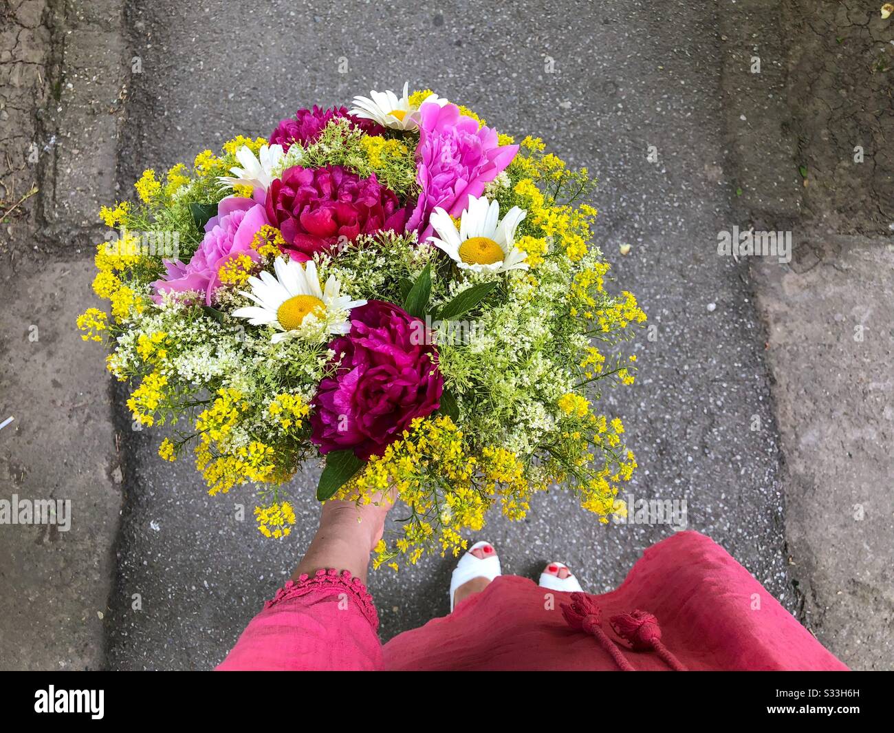 Woman holding bouquet of colorful flowers - Smartphone Captured Stock Image
