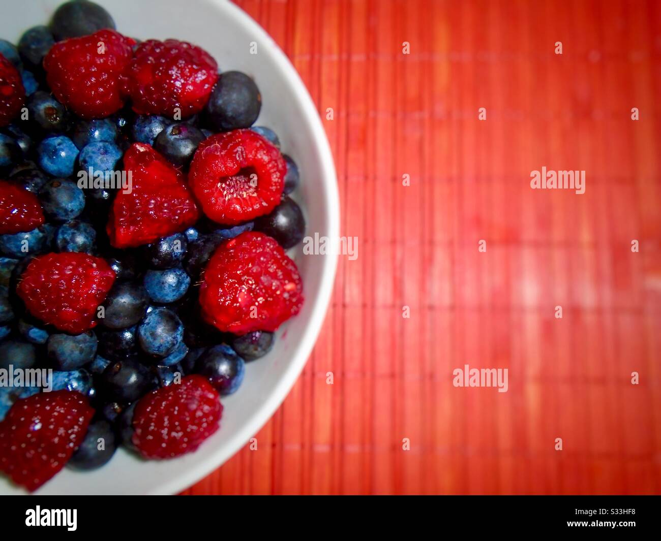 Bowl with blueberries and raspberries - Smartphone Captured Stock Image