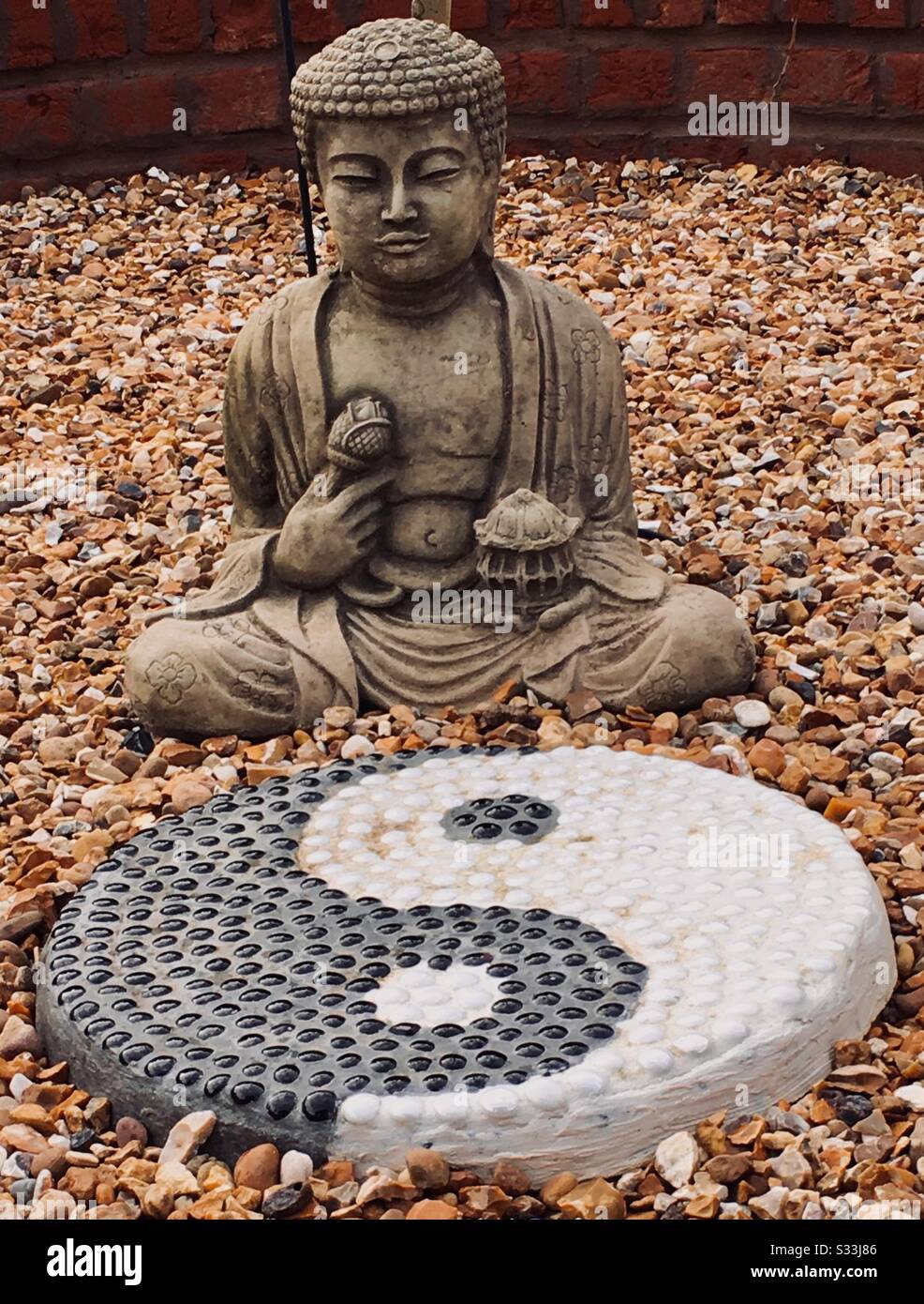 Buddha and Yin Yang symbol Stock Photo Alamy