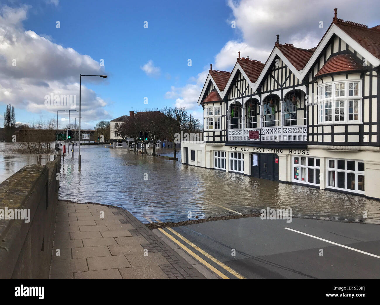 River Severn flooding affecting The Old Rectifying House pub, along N Parade, in Worcester, UK. Taken from Worcester bridge in February 2020. - Smartphone Captured Stock Image