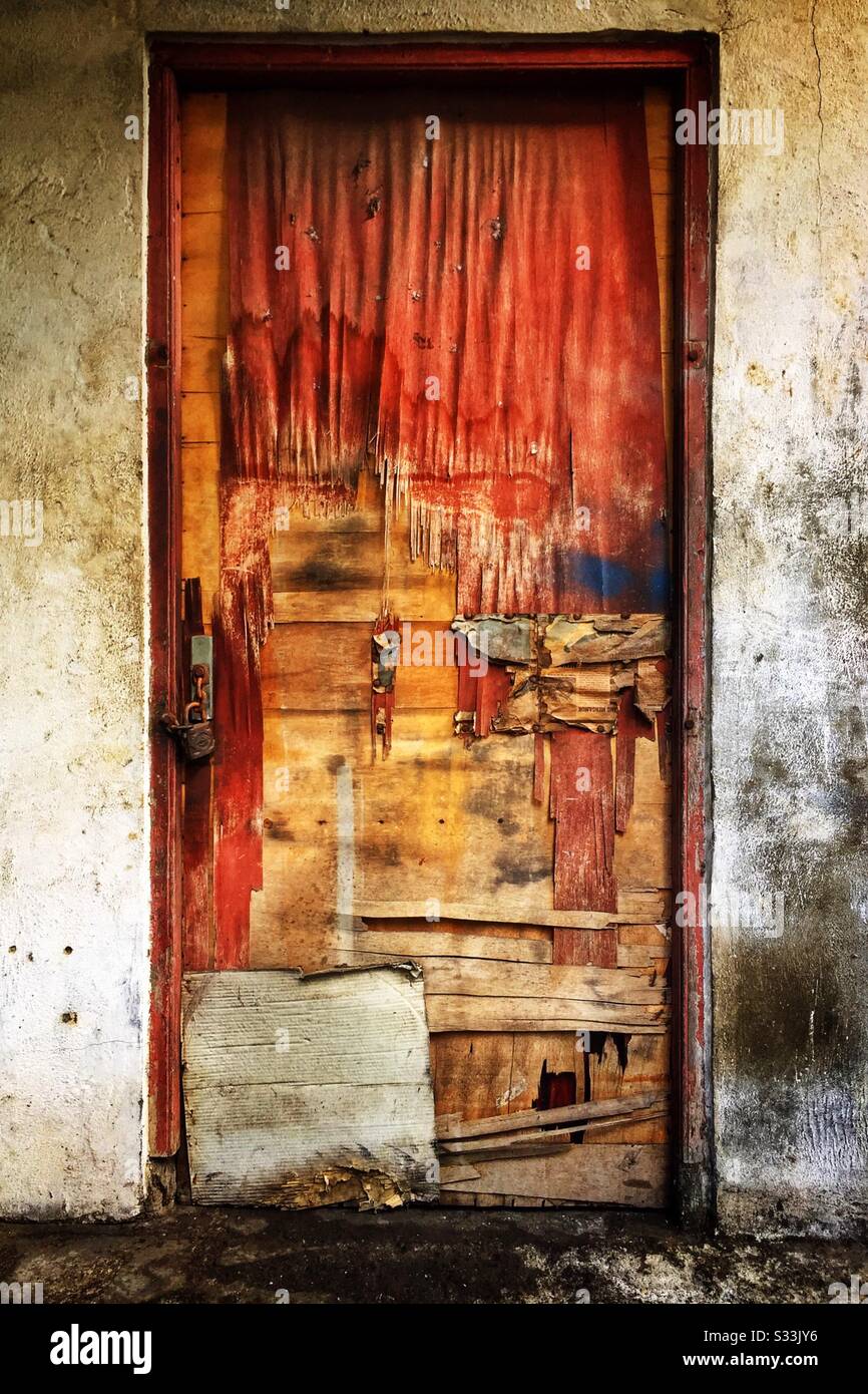 Weathered plywood door in Candidasa, Bali, Indonesia - Smartphone Captured Stock Image