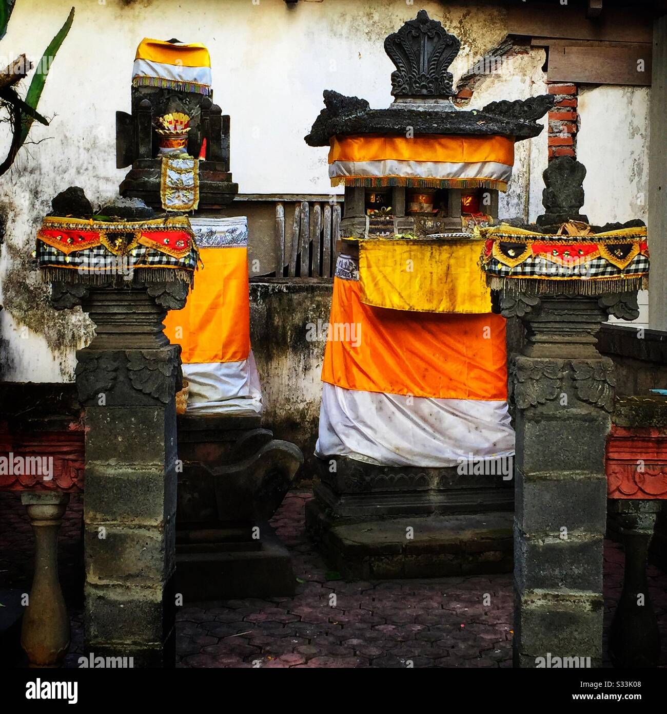 Decorations in a house pura (temple) in Candidasa, Bali, Indonesia - Smartphone Captured Stock Image