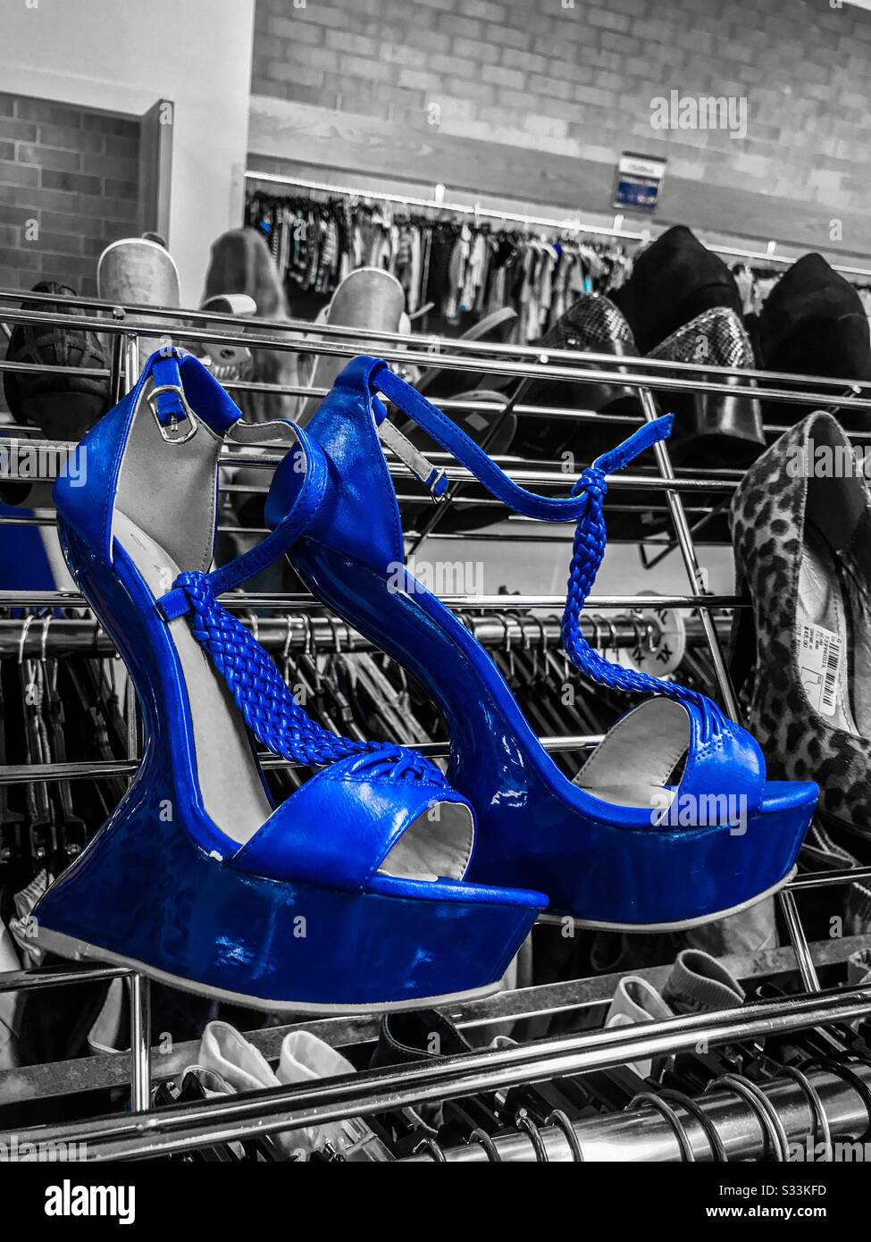 Blue color pop photo of odd blue patent women’s high sandals - Smartphone Captured Stock Image