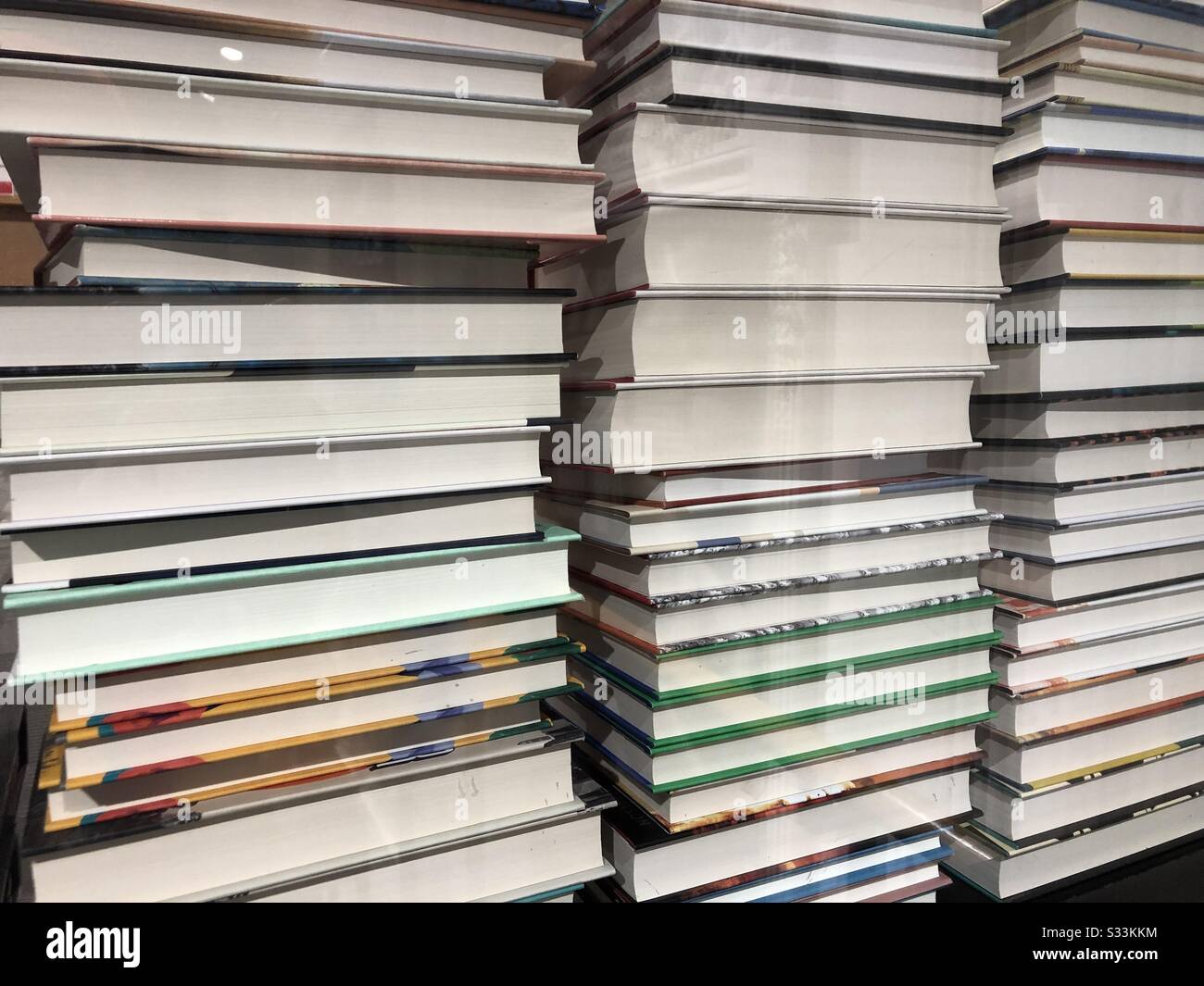 Stacked Piles of Hardcover Books Stock Photo