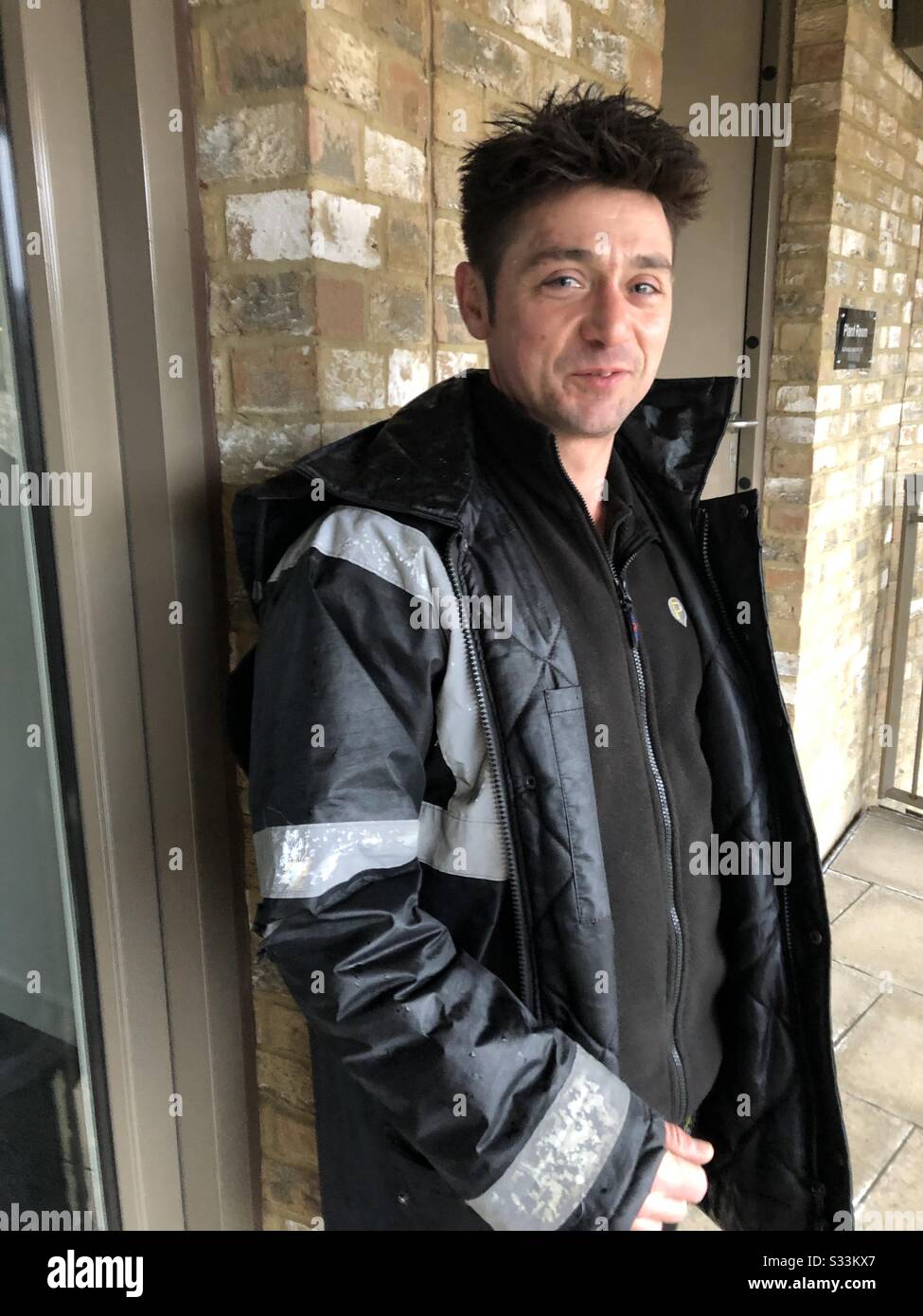 Portrait adult man building supervisor manager at work in London - Smartphone Captured Stock Image