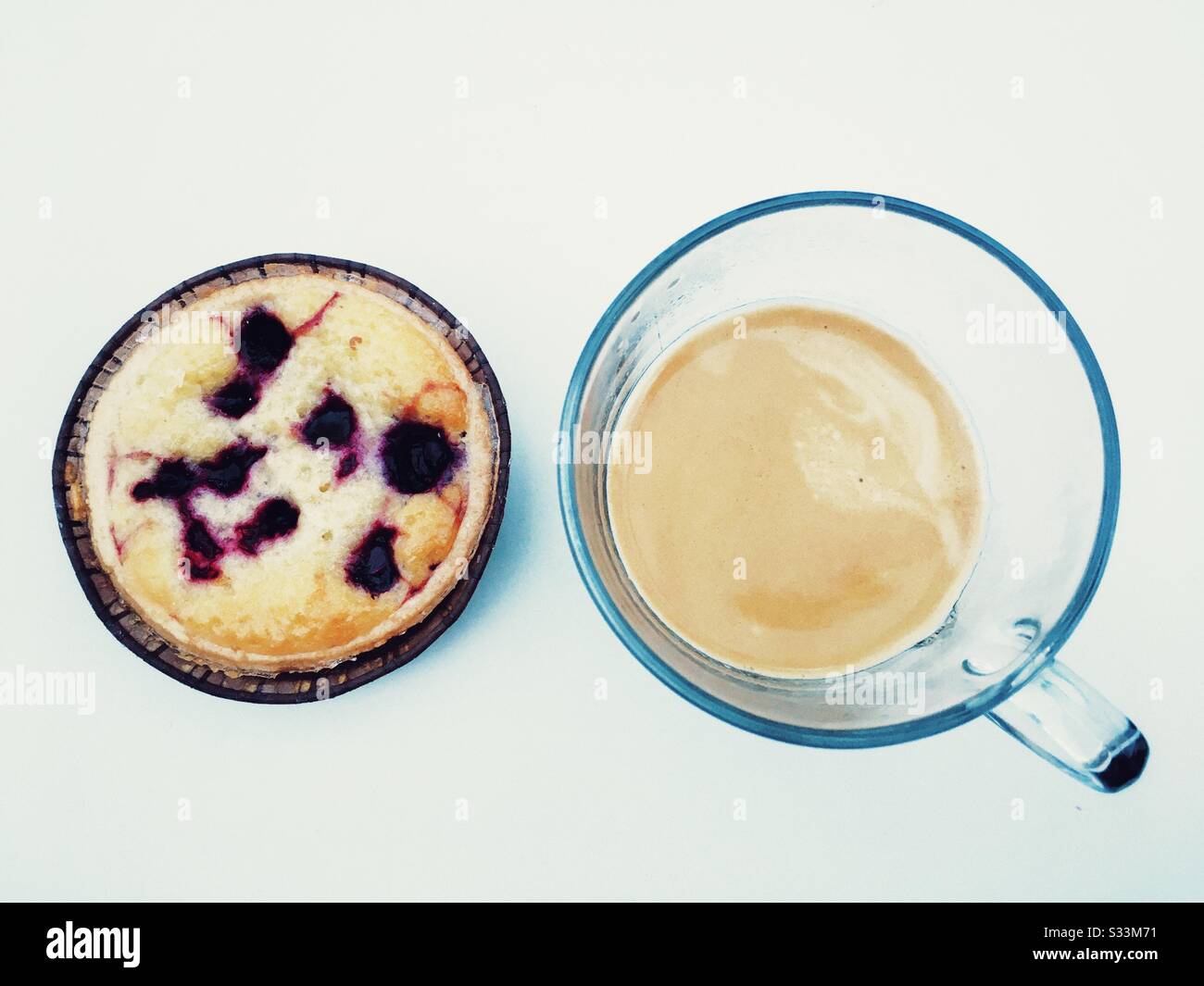 M&S almond and blueberry tart with coffee - Smartphone Captured Stock Image