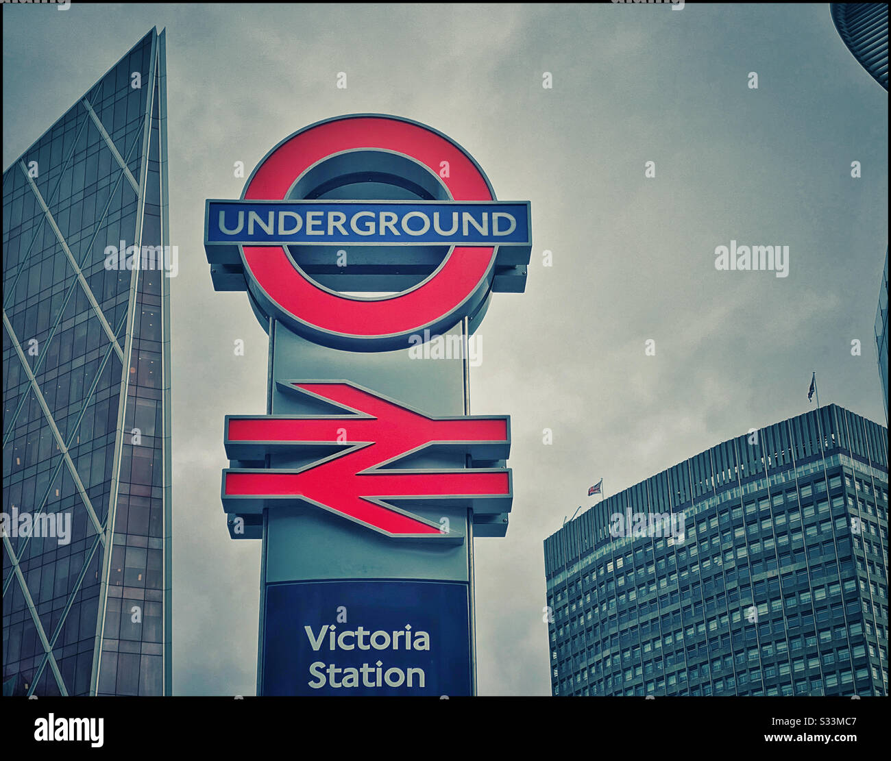 The iconic and famous British Rail and London Underground signs at Victoria Station. The meeting point of the Circle, District & Victoria Lines. Photo Credit - © COLIN HOSKINS. Stock Photo