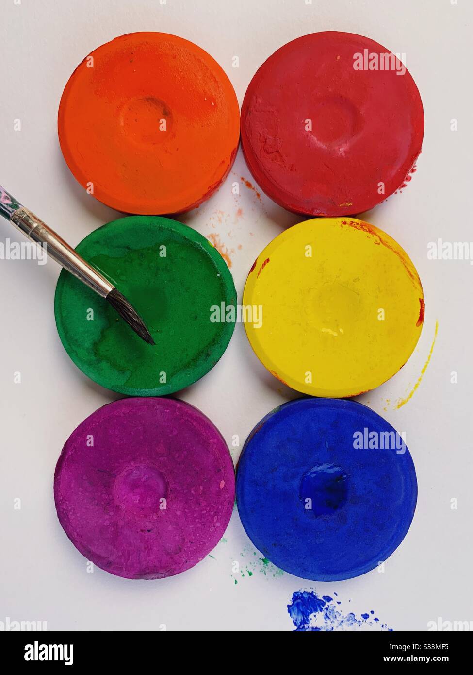 Tempera cake paints with paintbrush - Smartphone Captured Stock Image