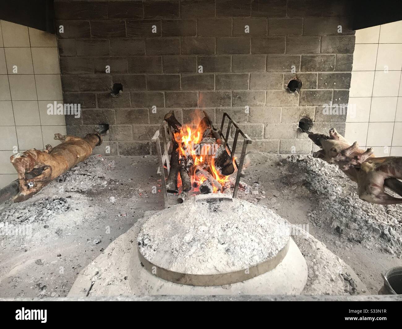 Roasting lamb on an old traditional way in Klis, Croatia - Smartphone Captured Stock Image