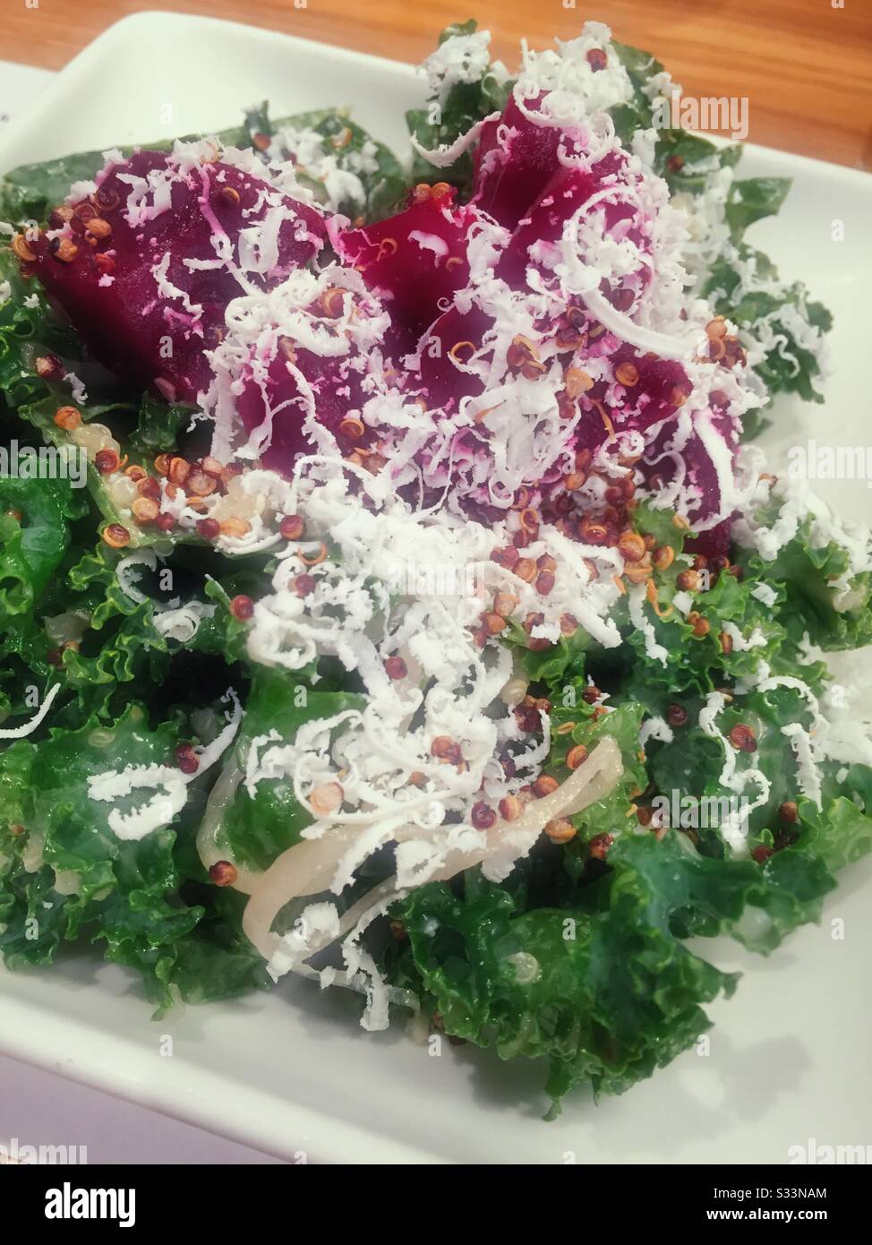 Close up of a salad entrée of quinoa, kale and beets in an upscale American restaurant, USA Stock Photo