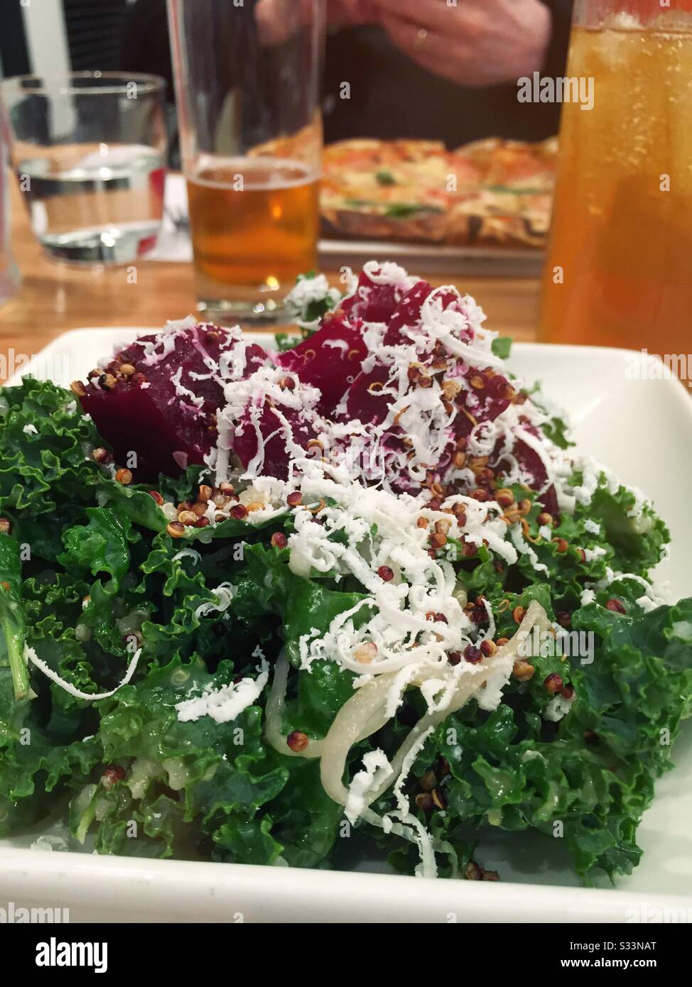 Close up of a restaurant meal of quinoa, kale and beet salad, USA - Smartphone Captured Stock Image