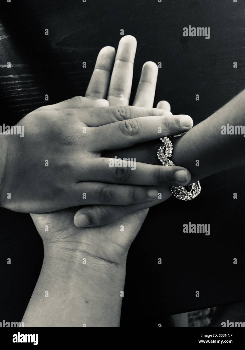 Three hands together in bonding .. its bonding which is beyond in words