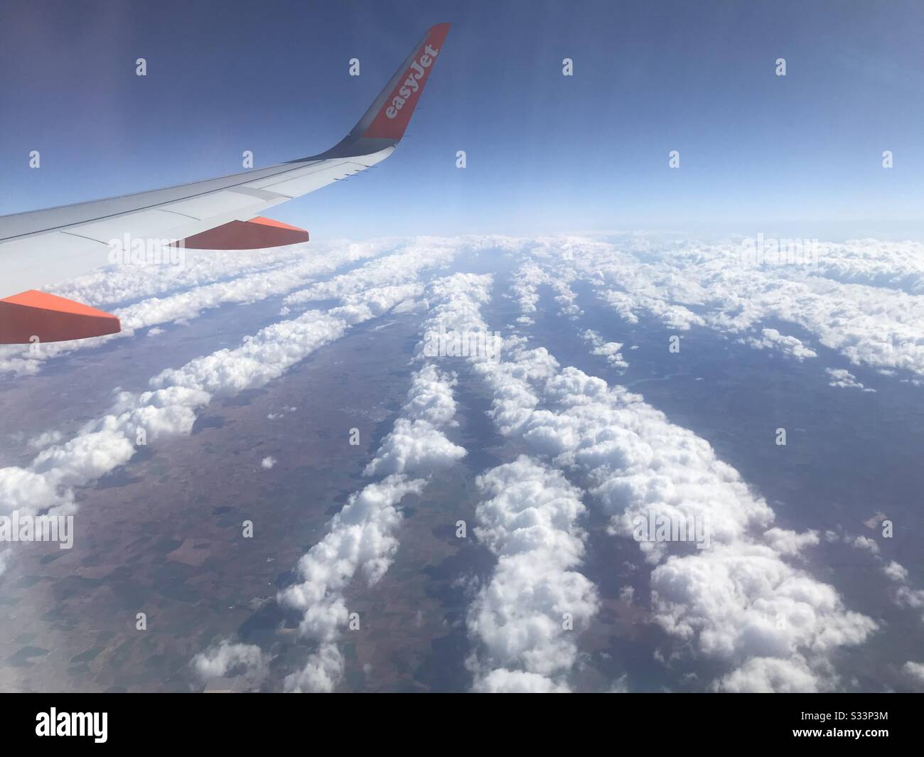 Striped clouds over Spain. Stock Photo