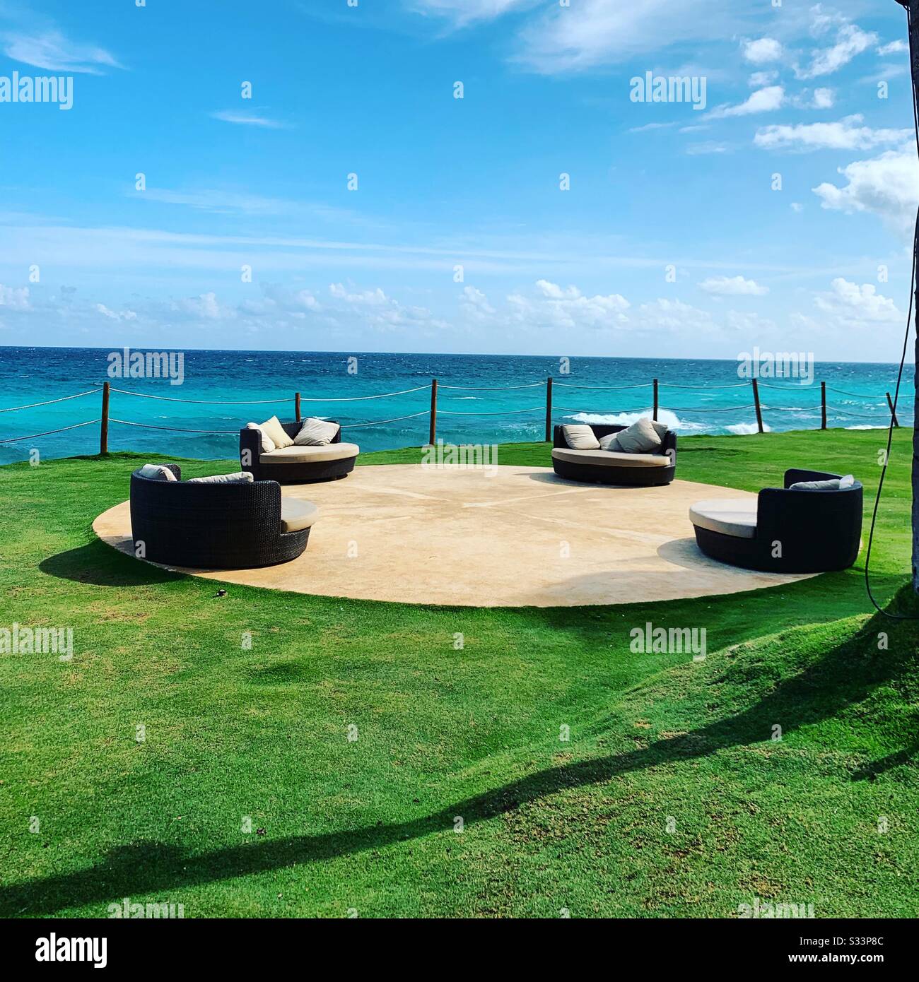 Seats overlooking the ocean on the Hyatt Ziva Resort grounds, Cancun, Quintana Roo, Yucatan Peninsula, Mexico - Smartphone Captured Stock Image