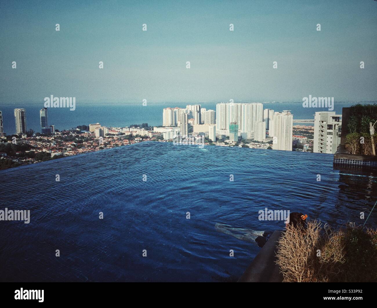 Swimming at tbe top of a high rise condo. - Smartphone Captured Stock Image
