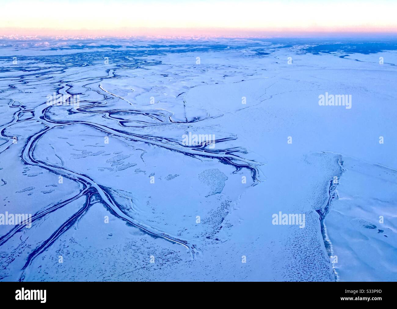 Aerial view of the frozen tundra and local river systems in the Alaskan Arctic in winter. Near Kotzebue, Alaska in the Northwest Arctic Borough Stock Photo