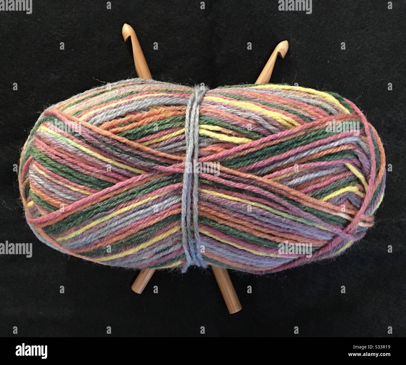Ball of yarn with crochet hooks Stock Photo
