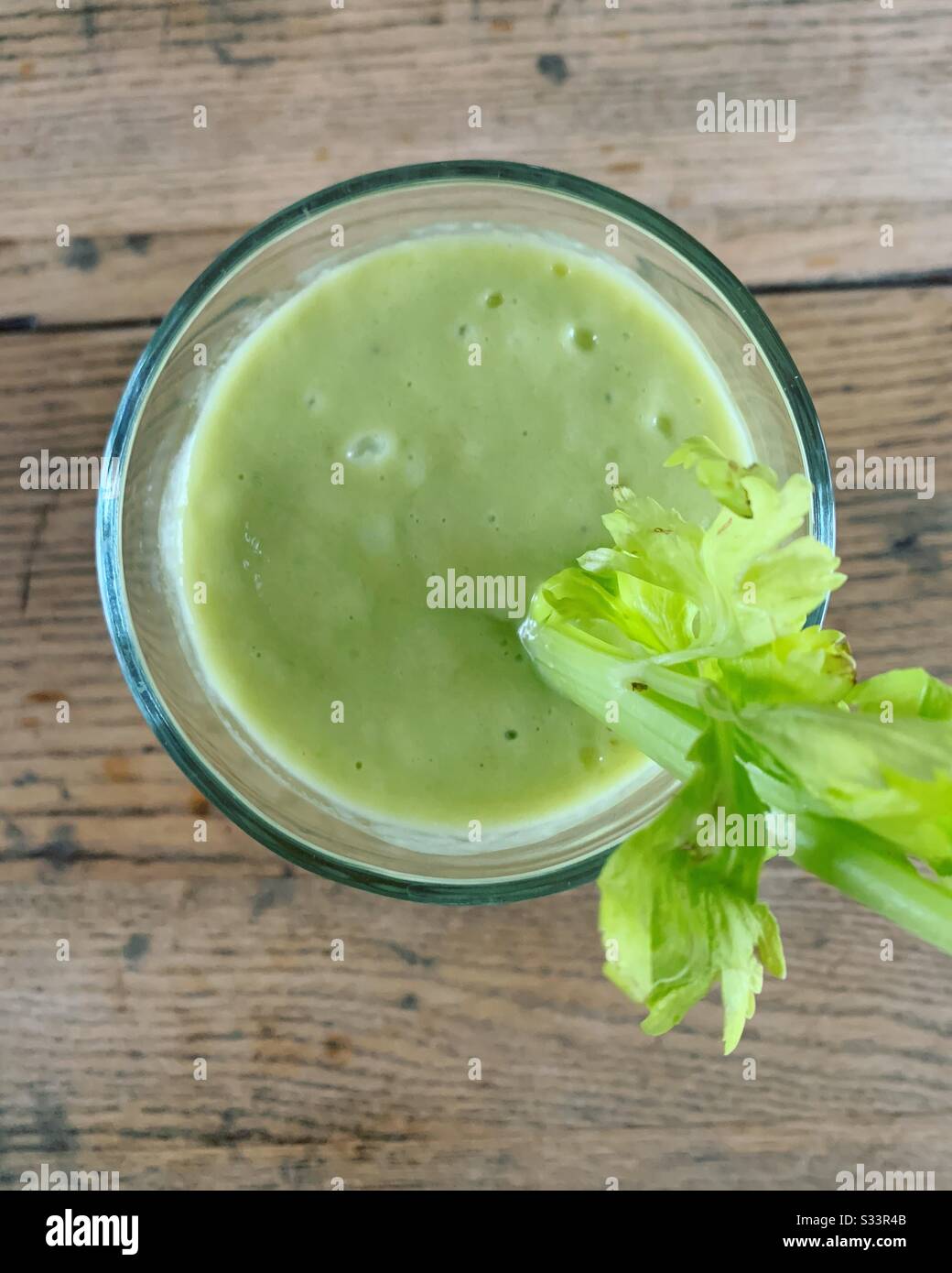 Green smoothie with celery garnish - Smartphone Captured Stock Image