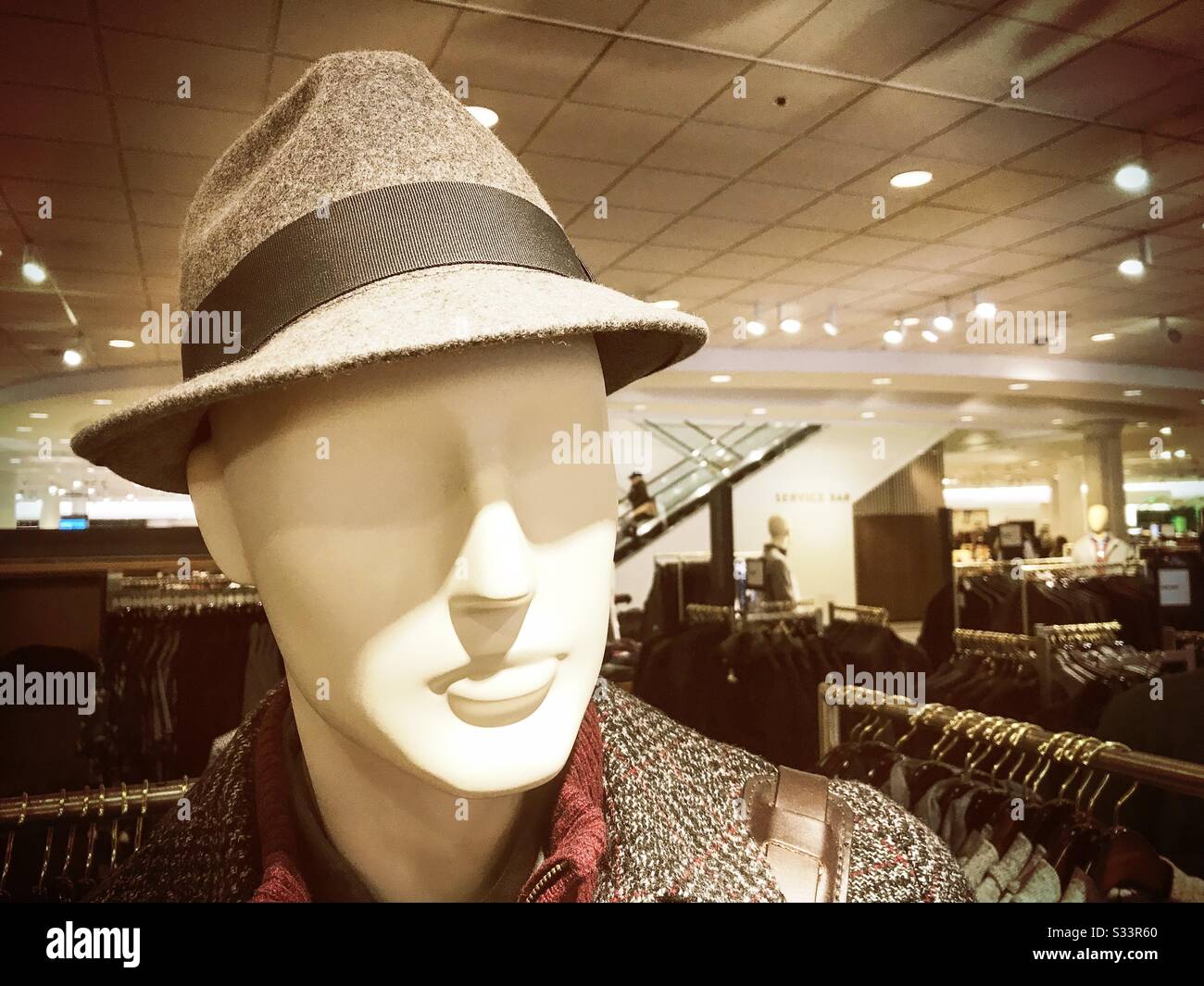 A mannequin in a shop wearing a fedora style hat - Smartphone Captured Stock Image