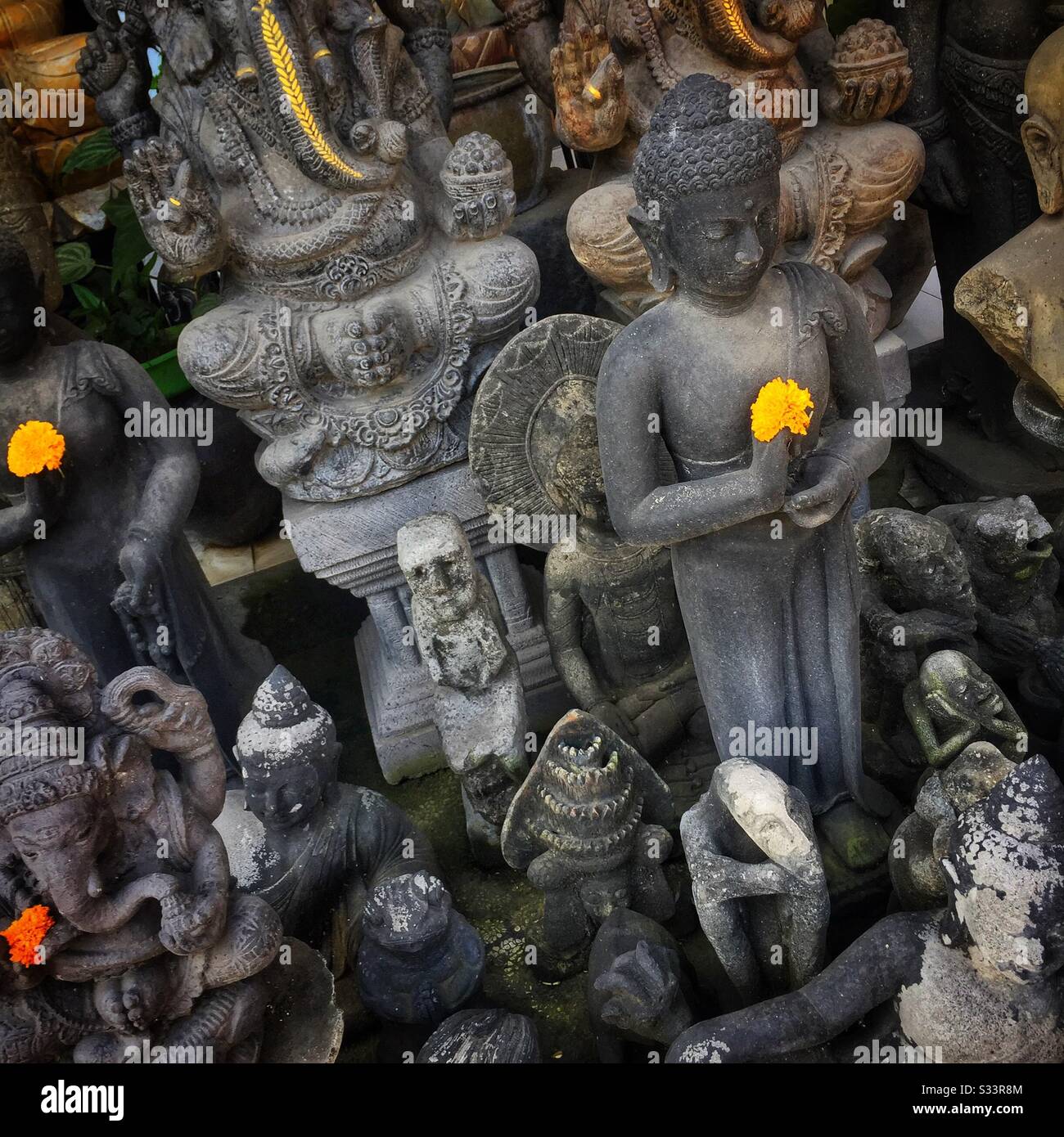 The Buddha, Ganesha and other statues for sale in souvenir shop, Candidasa, Bali, Indonesia - Smartphone Captured Stock Image