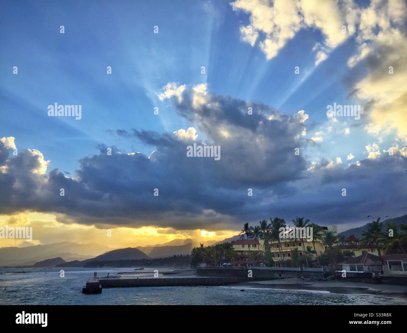 Sunset at Bali Palms Resort, Candidasa, Bali, Indonesia - Smartphone Captured Stock Image