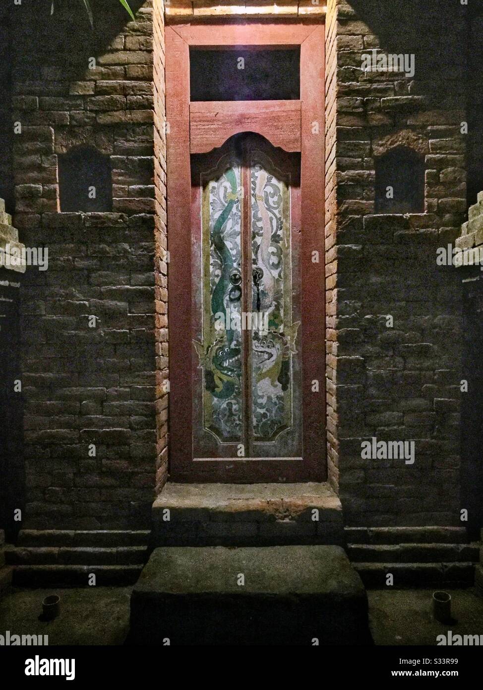 Entrance to a residential house at night, Candidasa, Bali, Indonesia Stock Photo