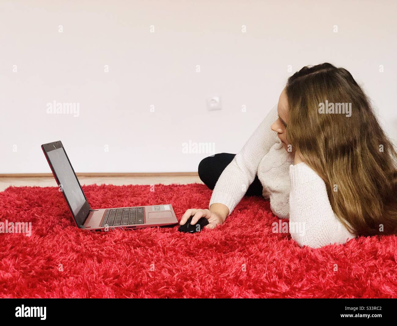 Woman working on her laptop - Smartphone Captured Stock Image