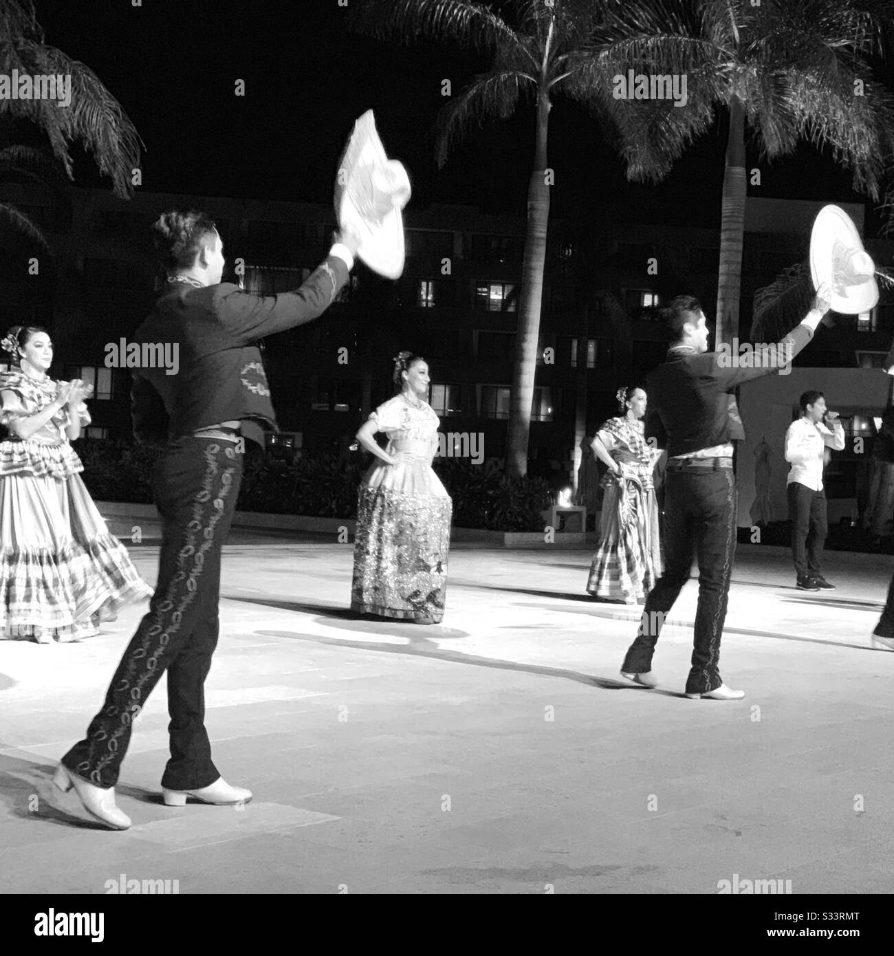Black and white image of Mexican Night Dancers, Hyatt Ziva Resort, Cancun, Quintana Roo, Yucatan Peninsula, Mexican - Smartphone Captured Stock Image