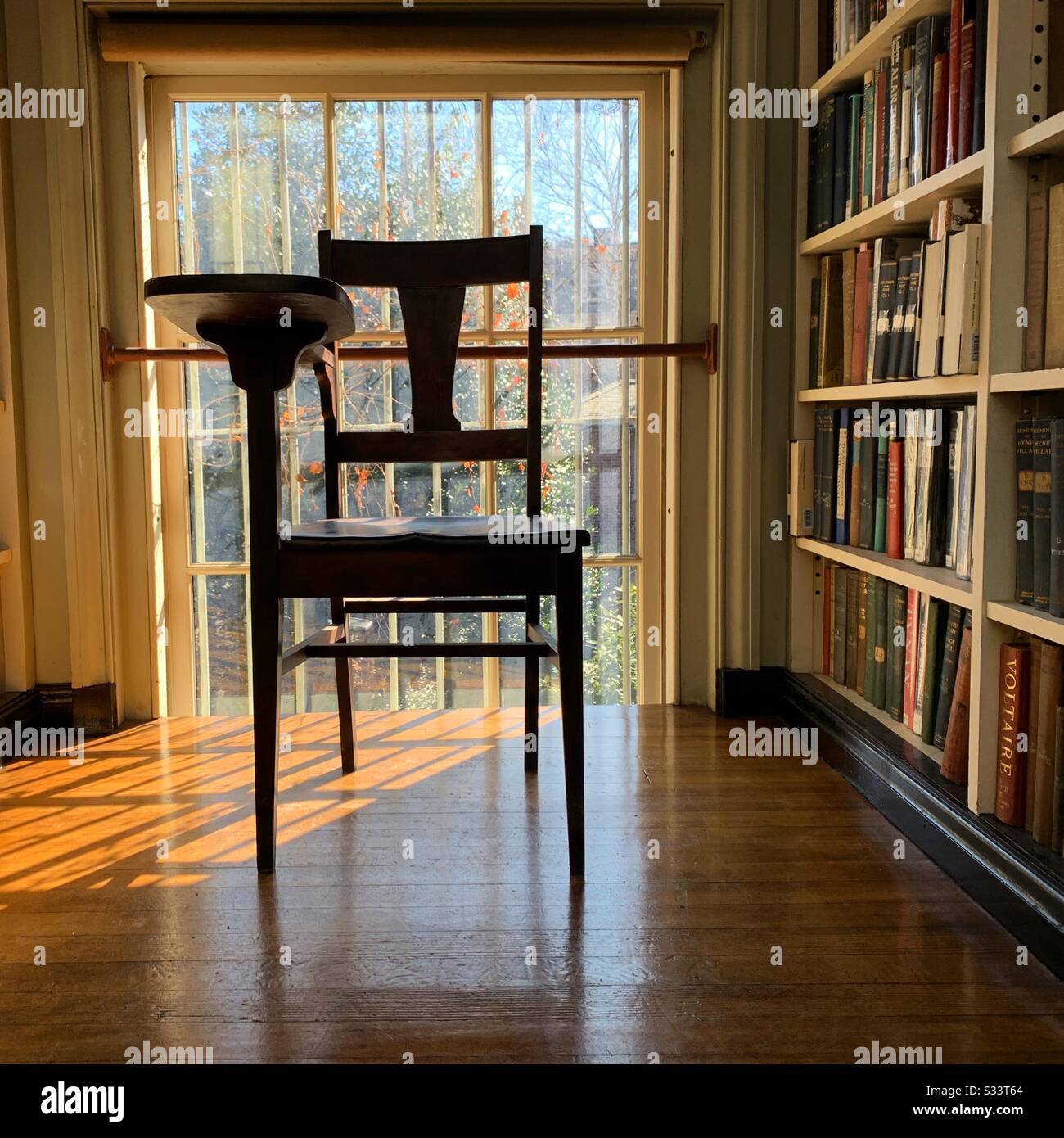 Desk chair in front of a window, Providence Athenaeum, Providence, Rhode Island, United States - Smartphone Captured Stock Image