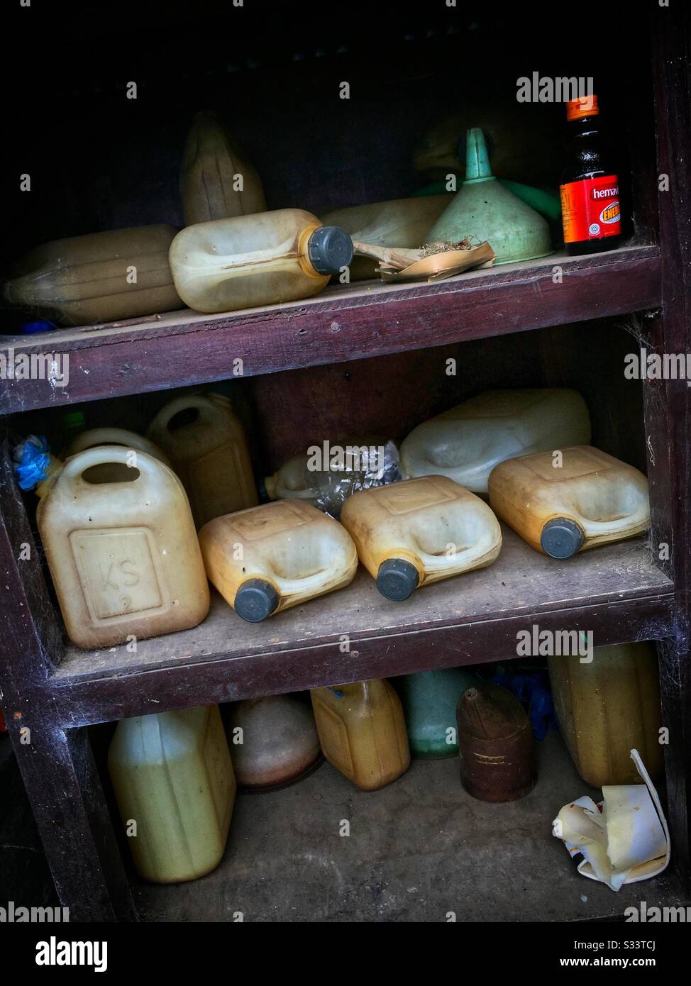 Petrol for sale in plastic containers at the lookout spot over Lake Batur, Bali, Indonesia - Smartphone Captured Stock Image