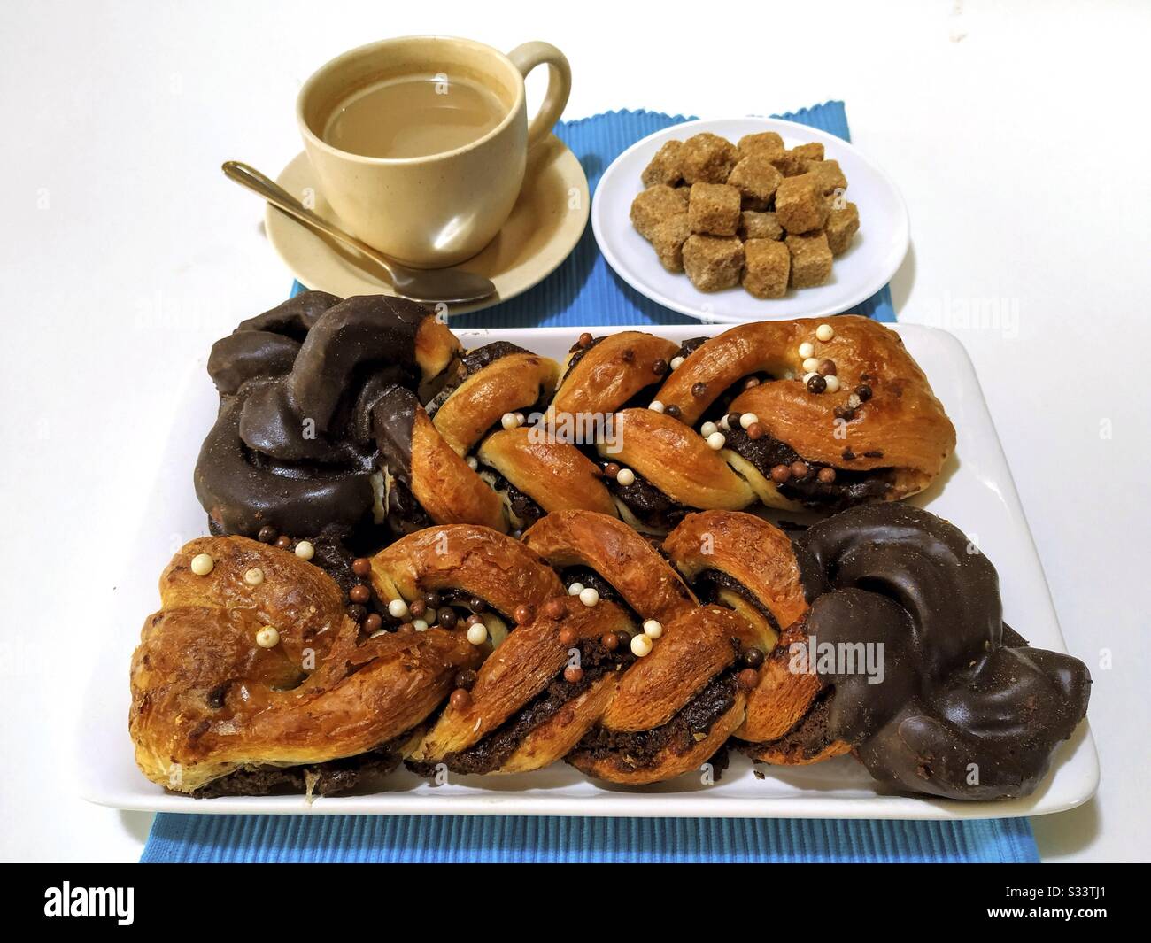 Pastries with white coffee. Stock Photo