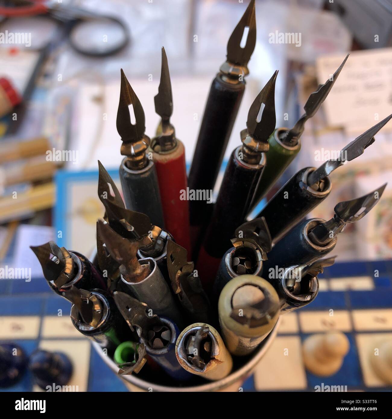Collection of ink pens with bibs for ink handwriting and calligraphy in a jar - Smartphone Captured Stock Image