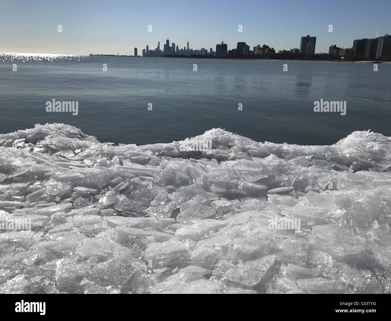 Chicago skyline from a distance over Lake Michigan Stock Photo Alamy