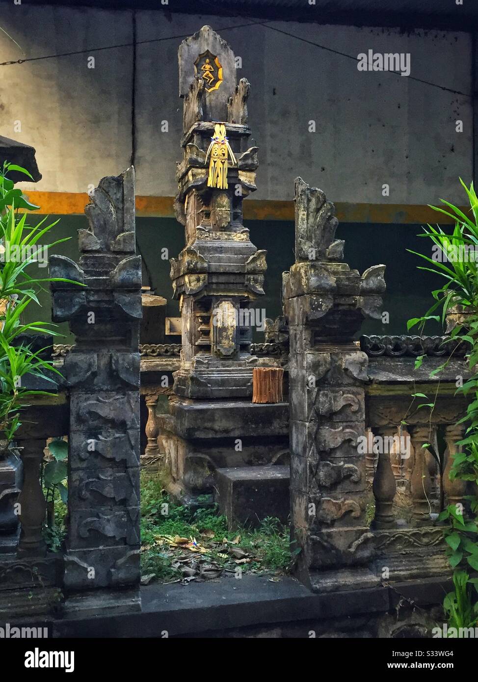Shrine outside a factory building, Candidasa, Bali, Indonesia Stock Photo