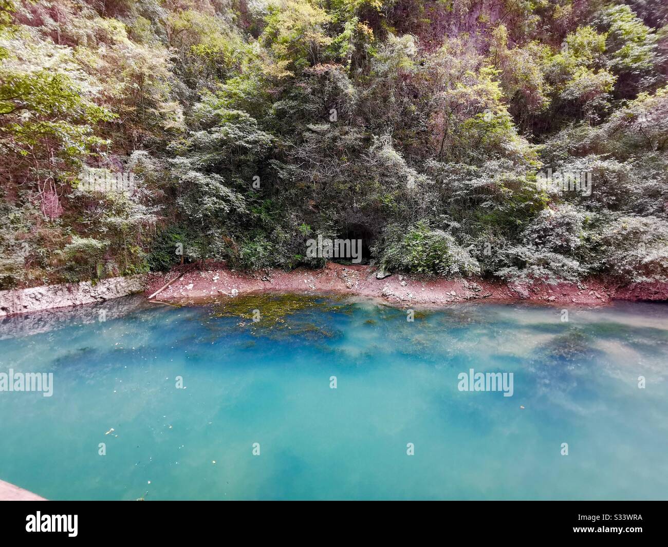 Turquoise water in the small ponds along the river at Zhangjiajie’s Grand Canyon. - Smartphone Captured Stock Image