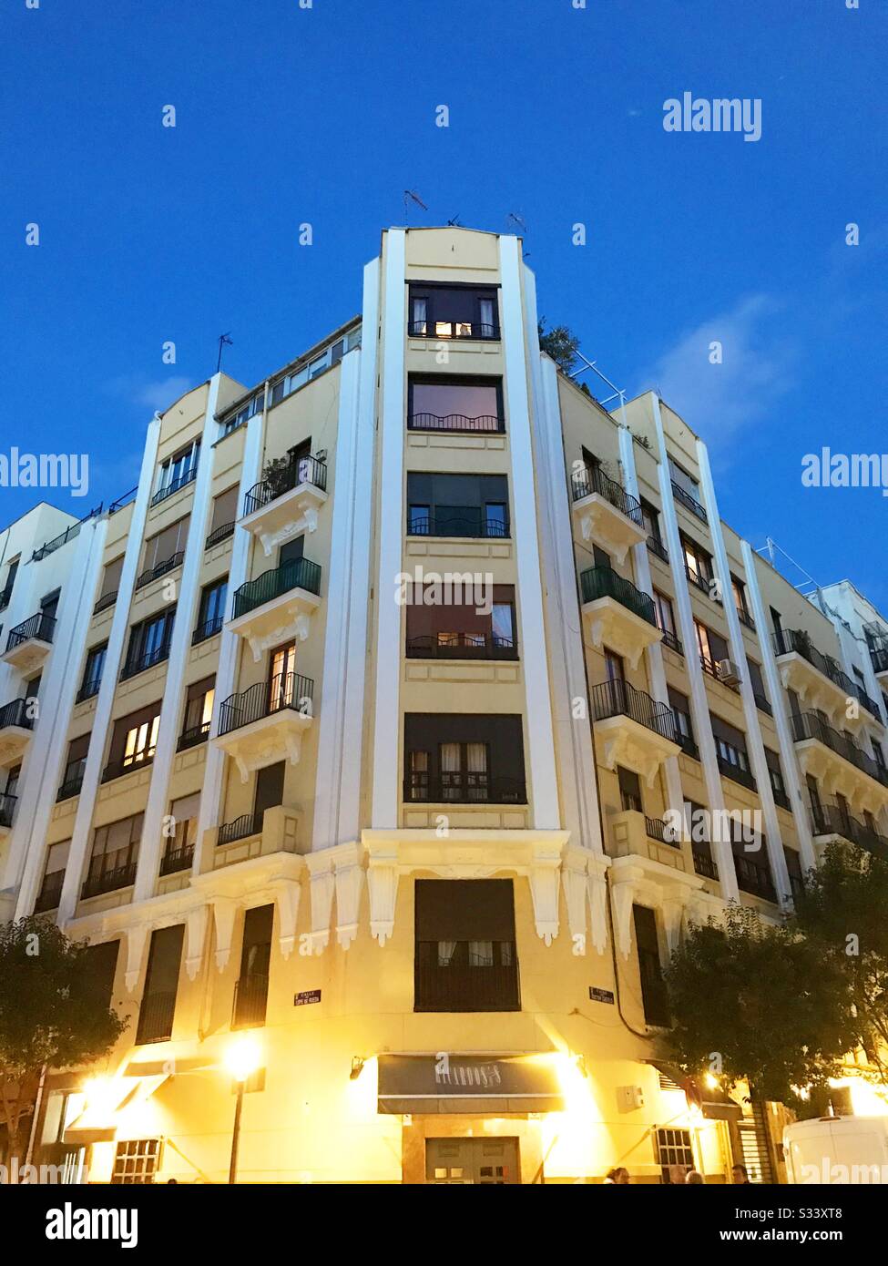 Facade of house, night view. Madrid, Spain. - Smartphone Captured Stock Image